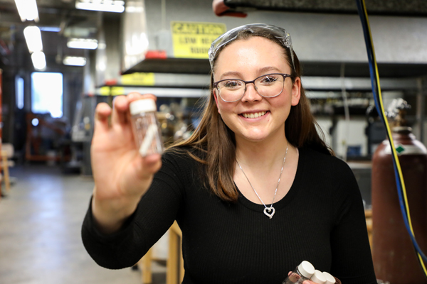 Baylie Phillips holding a small jar.